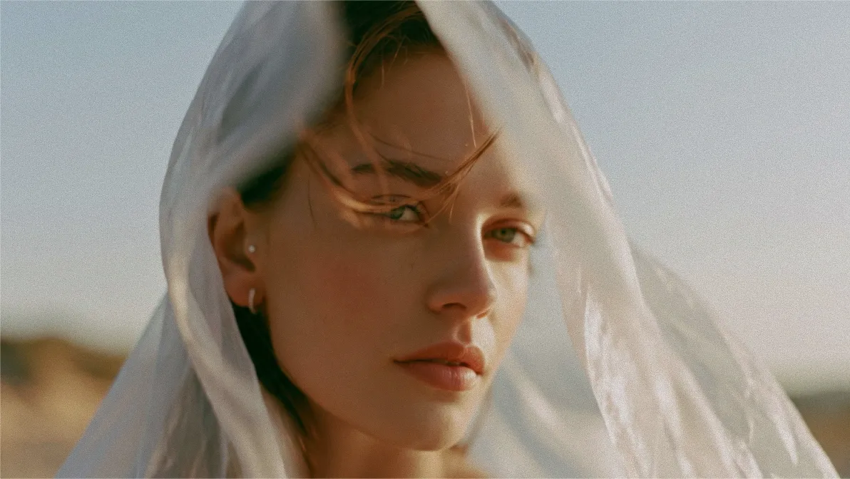 A veiled woman in soft golden light